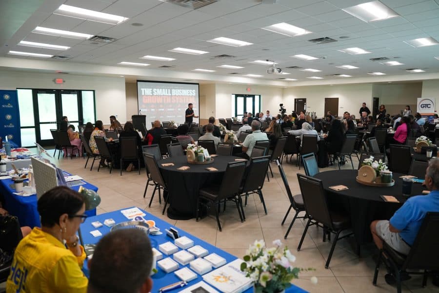 The Summit room with resource tables and attendees