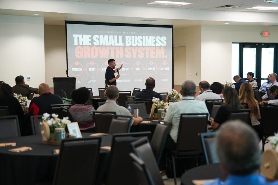 Wide view of the room during “The Small Business Growth System” section